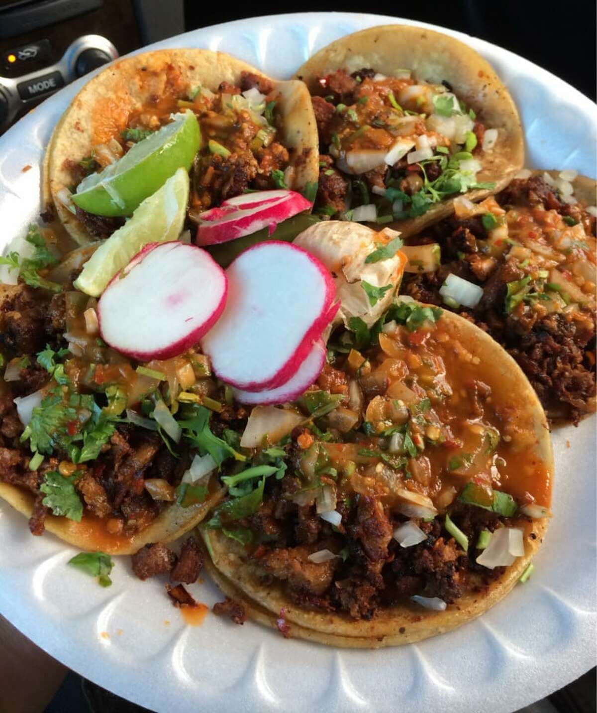 Tacos al pastor with the requisite sliced radish and limes at Oakland food truck, Tacos El Gordo.