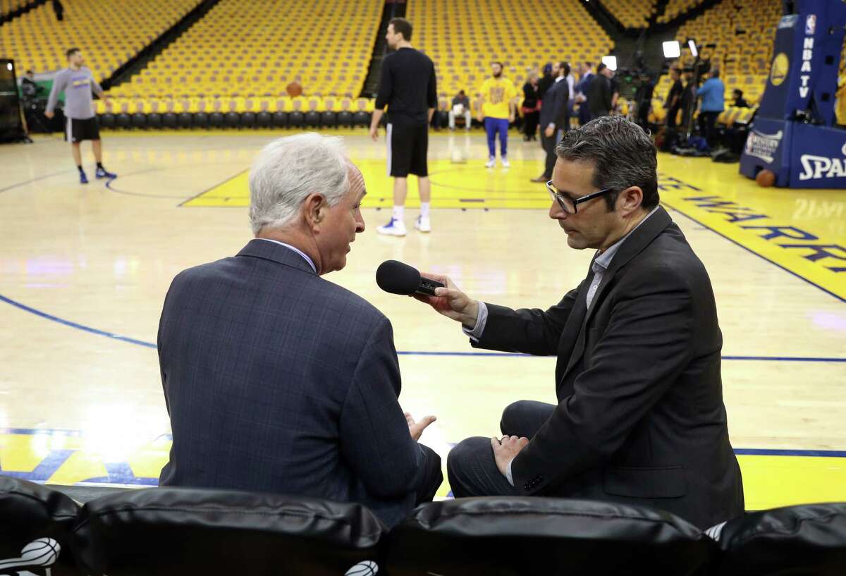 Golden State Warriors' team multimedia producer Laurence Scott interviews ABC7's Mike Schumann before Warriors play San Antonio Spurs in Game 2 of NBA Western Conference Finals in Oakland, Calif., on Tuesday, May 16, 2017.