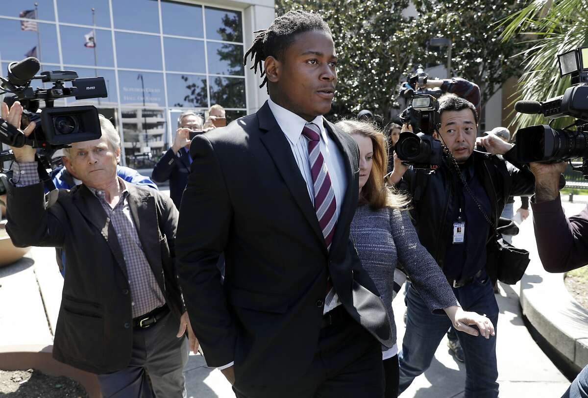 San Francisco 49ers linebacker Reuben Foster, center, exits the Santa Clara County Superior Court after his arraignment, Thursday, April 12, 2018, in San Jose, Calif. Foster has been charged with felony domestic violence after being accused of attacking his girlfriend, authorities said.