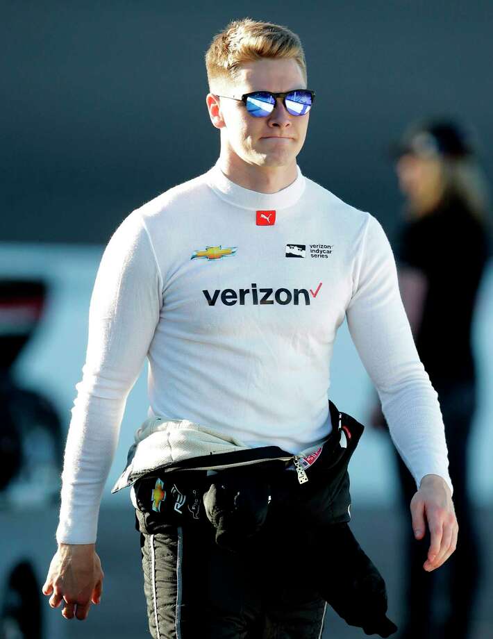 FILE - In this April 7, 2018, file photo, Josef Newgarden walks before an IndyCar auto race at Phoenix International Raceway in Avondale, Ariz. Graham Rahal loves what he's seeing at the top of the IndyCar series standings so far this season. Twenty-something Americans Alexander Rossi, Josef Newgarden and Rahal are lined up neatly at the top heading into Sunday's, April 22, 2018, race at Barber Motorsports Park. (AP Photo/Rick Scuteri, File) Photo: Rick Scuteri / FR157181 AP
