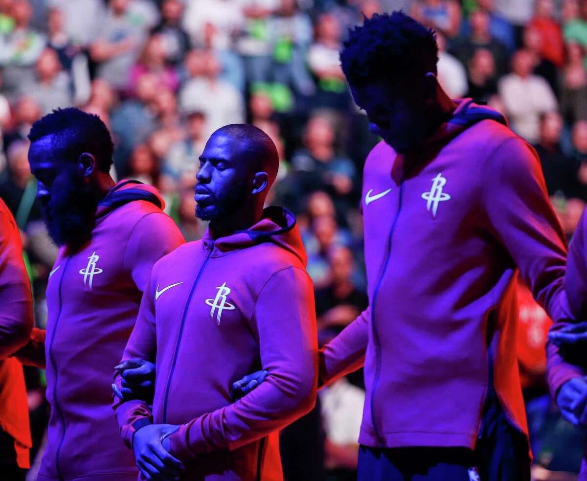 Houston Rockets guard James Harden (13), Houston Rockets guard Chris Paul (3) and Houston Rockets center Clint Capela (15) stand for the National Anthem before Game 4 of the first round of the NBA Playoffs against the Minnesota Timberwolves at Target Center Monday, April 23, 2018 in Minneapolis.