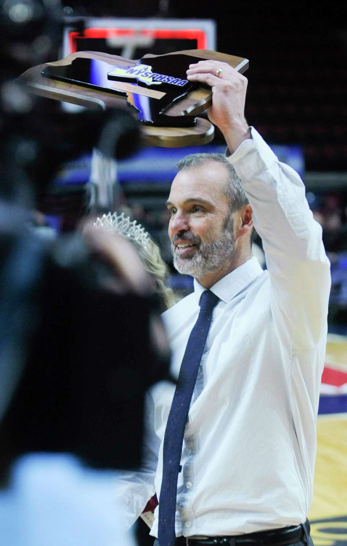Lake George coach Dave Jones hoists the championship trophy after Lake George beat Northstar Christian Academy, 65-64, in the NYSPHSAA Class C Boys Basketball final on Saturday, March 17, 2018, at Floyd L. Maines Arena in Binghamton, N.Y. (Tim Roske/Special to the Times Union)
