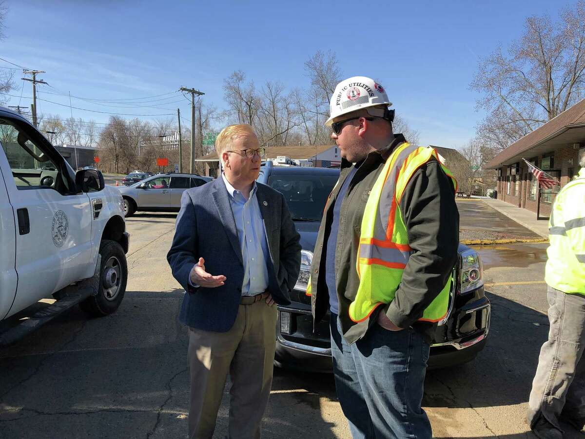 Danbury Mayor Mark Boughton and a Public Utilities Department worker on the scene of a major water main break on Tuesday, April 24, 2018. The broken water main is affecting operations at Danbury Hospital, closed two schools and left a third of the city without water or low water pressure. The break on Tamarack Avenue and Hayestown avenues that happened early Tuesday morning is affecting thousands of residents and scores of businesses