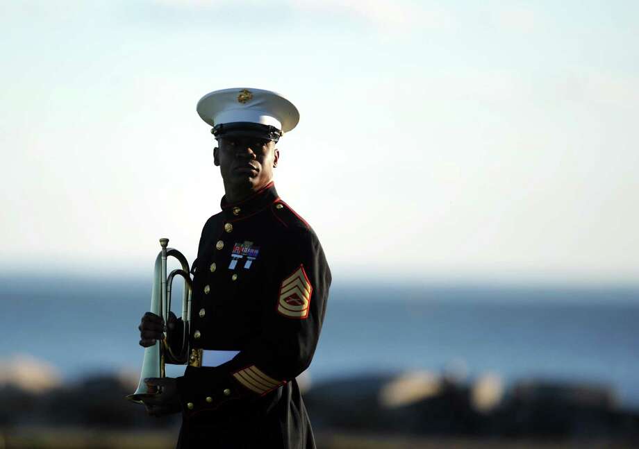 U.S. Marine Corps Gunnery Sergeant Orville Grizzle stands outside during Connecticut's 11th Annual 9/11 Memorial Service Monday, September 10, 2012 at Sherwood Island State Park in Westport, Conn. Photo: Autumn Driscoll / Autumn Driscoll / Connecticut Post