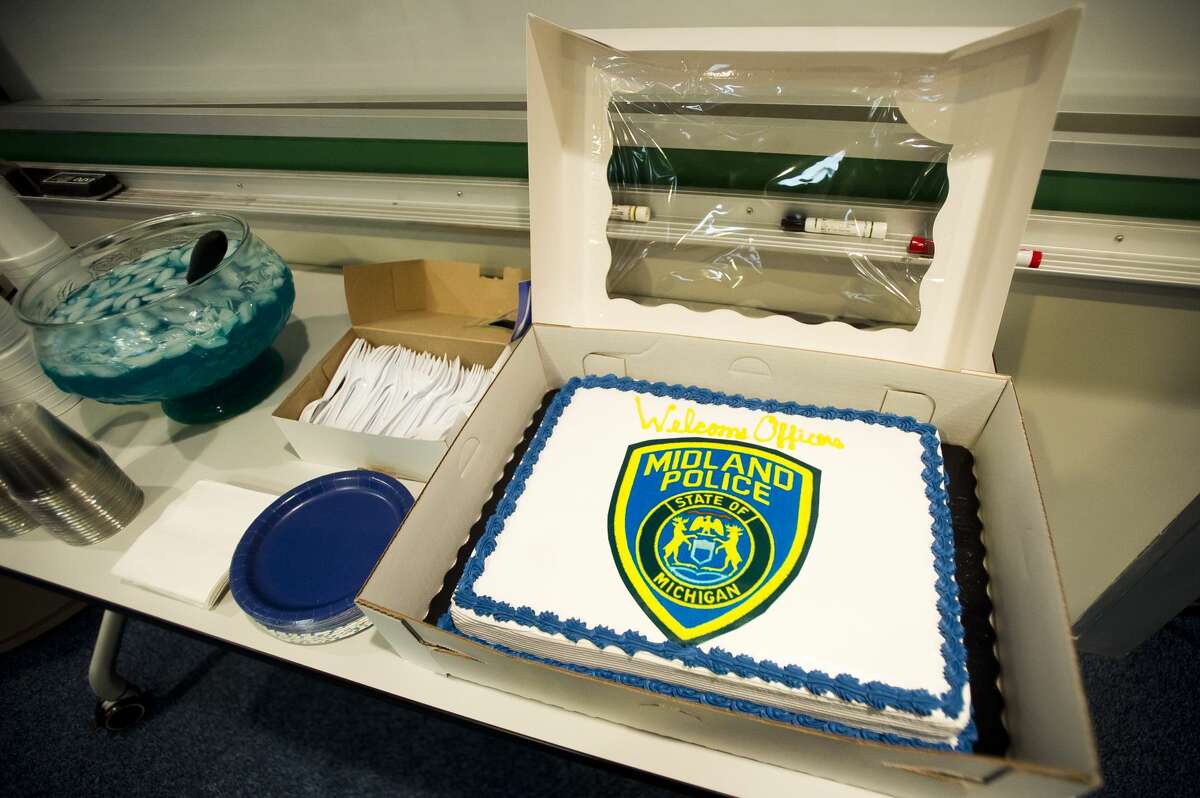 Cake is available during an officer swearing-in ceremony for Midland Police Department's two newest officers on Tuesday, April 24, 2018 at City Hall. (Katy Kildee/kkildee@mdn.net)