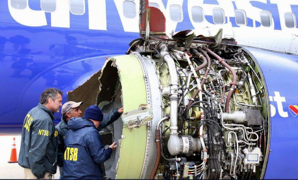 National Transportation Safety Board investigators inspect the Southwest Airlines engine that exploded in flight April 17, 2018.