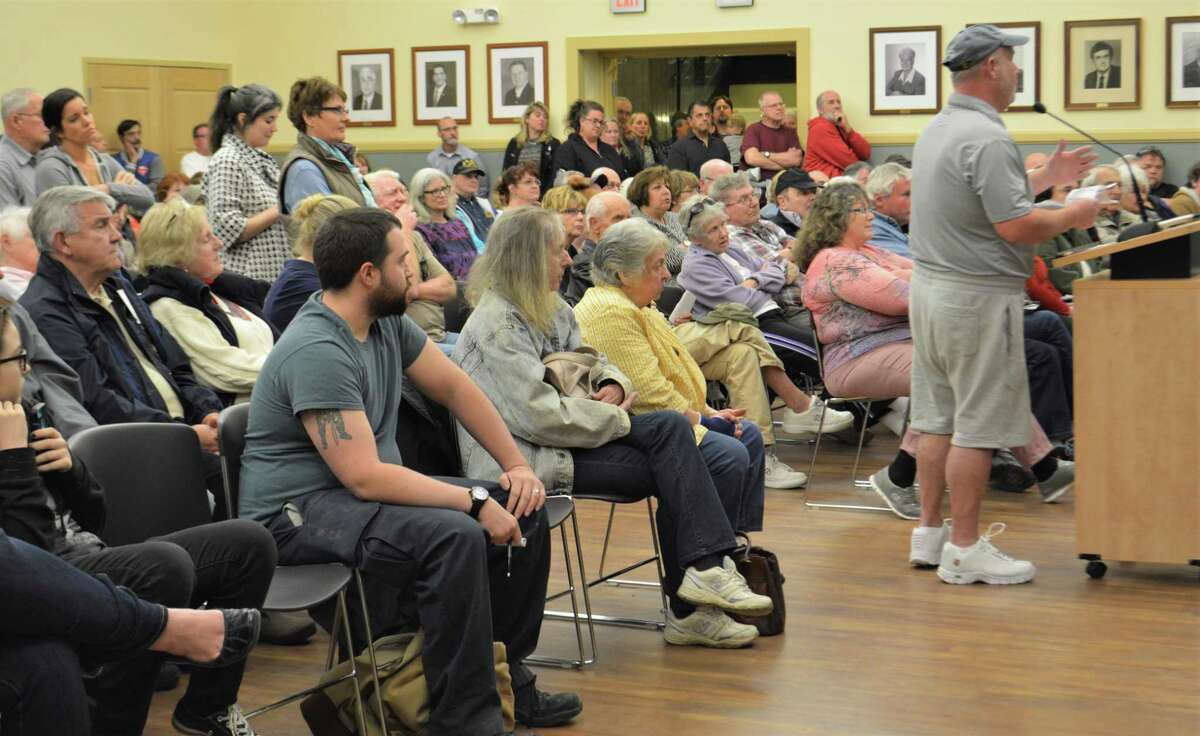 Resident Mike Driscoll, at the podium, right, weighs in on the proposed trash reduction program, SMART, during a public information meeting on Tuesday at Torrington City Hall.