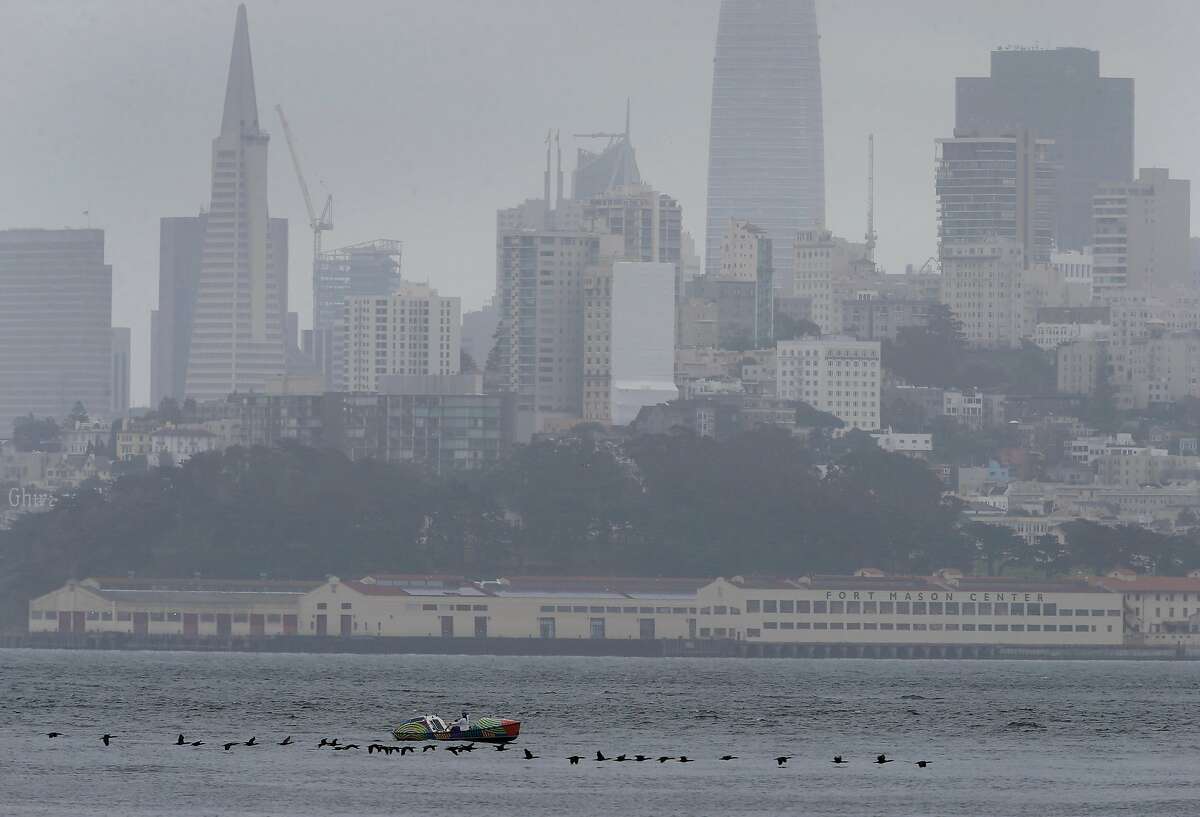 Lia Ditton rows her 21-foot boat on the bay towards the Golden Gate Bridge in San Francisco.