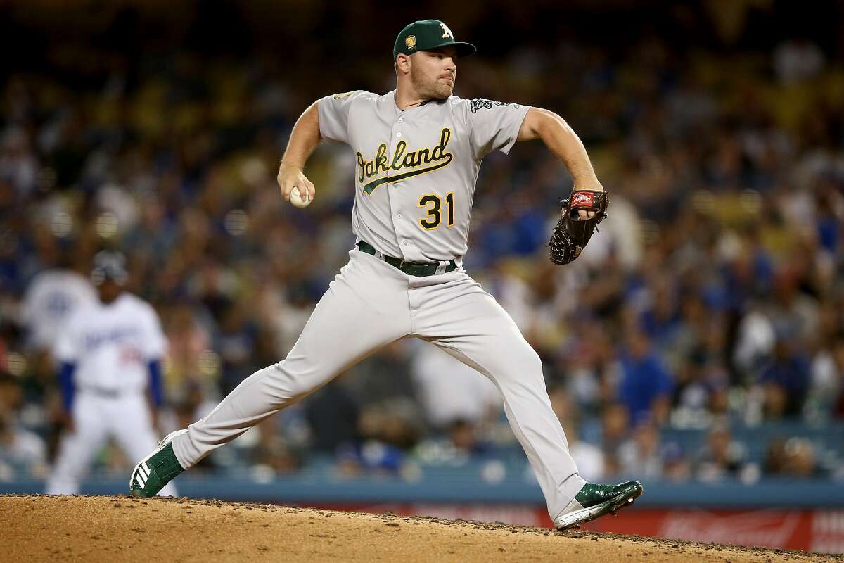 LOS ANGELES, CA - APRIL 10: Liam Hendriks #31 of the Oakland Athletics pitches during the sixth inning of a game against the Los Angeles Dodgers at Dodger Stadium on April 10, 2018 in Los Angeles, California. (Photo by Sean M. Haffey/Getty Images)