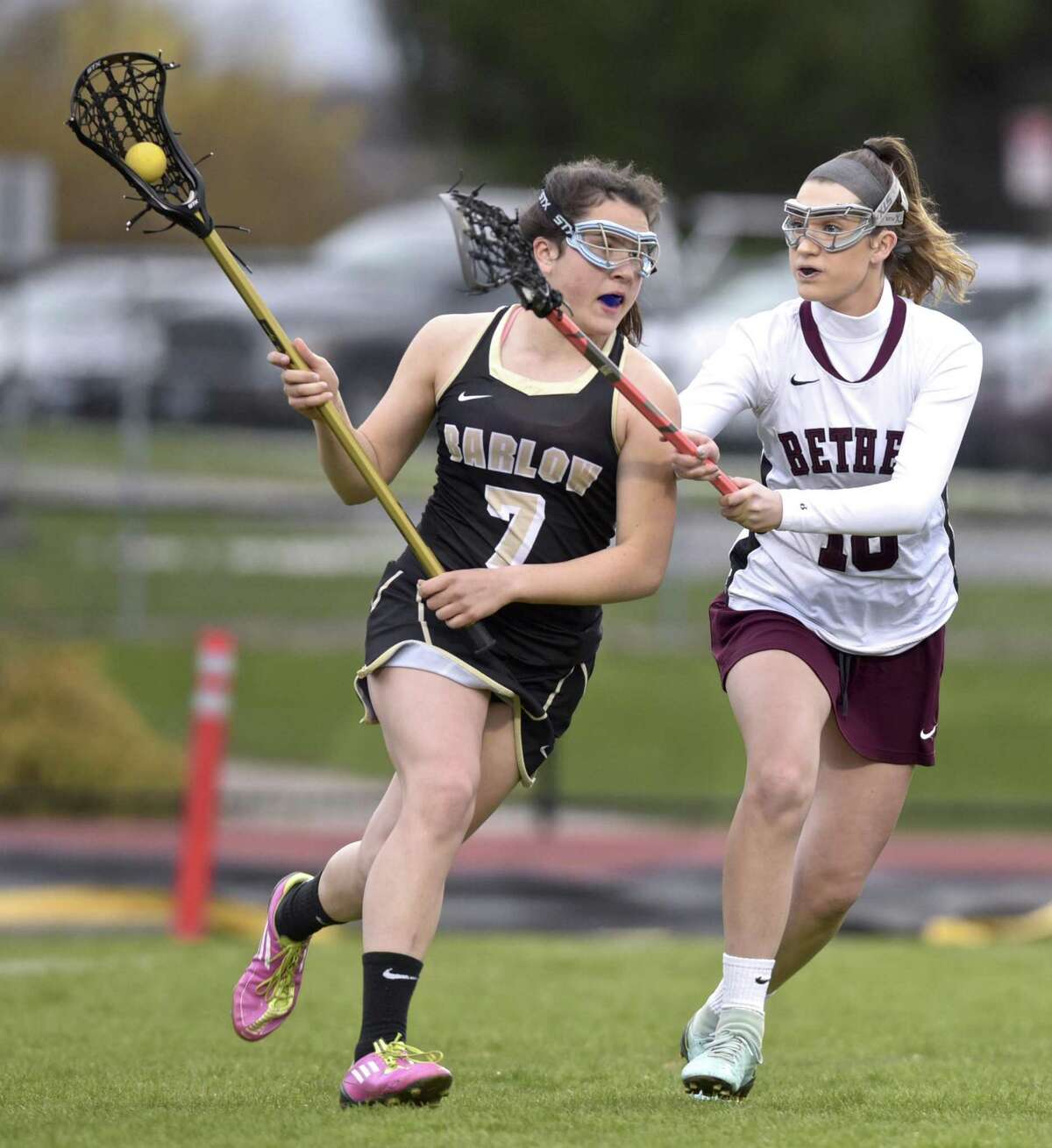 Barlow’s Emily Grob (7) moves behind the Bethel goal while being defended by Bethel’s Anna Riolo during their game Tuesday afternoon at Bethel High School.