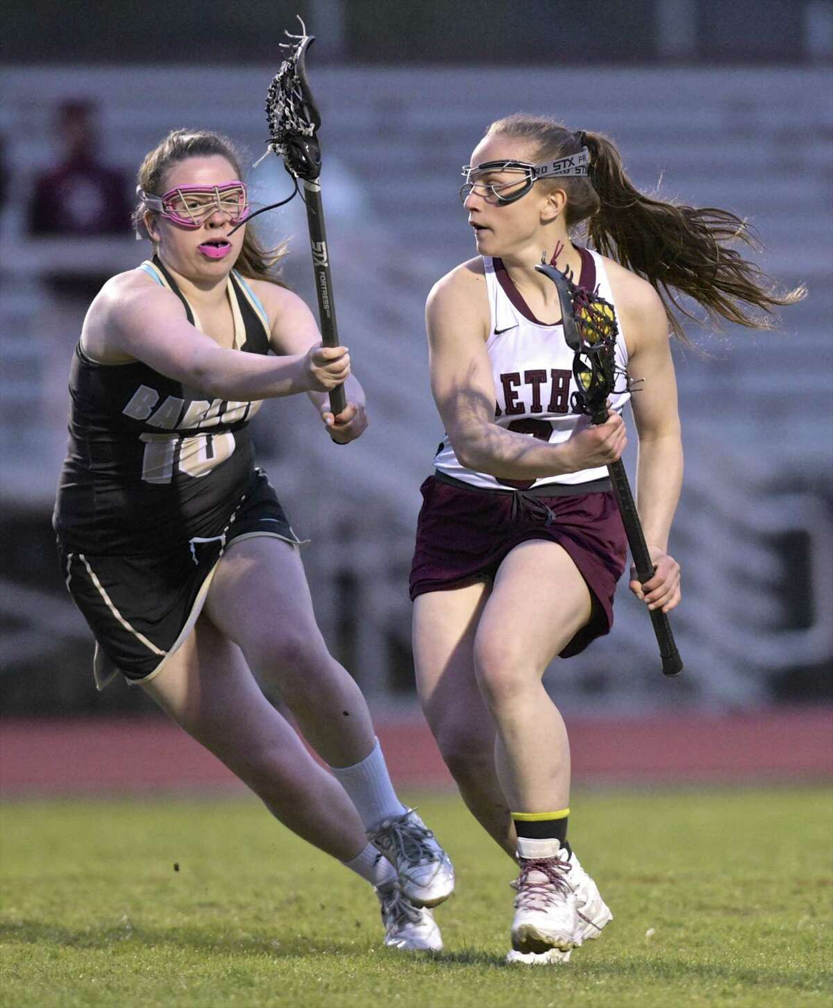 Joel Barlow's Molly Carroll (10) reaches out to block bethel's Christiana Ruiz (8) in the girls lacrosse game between Joel Barlow and Bethel high schools, Tuesday afternoon, April 24, 2018, at Bethel High School, Bethel, Conn.