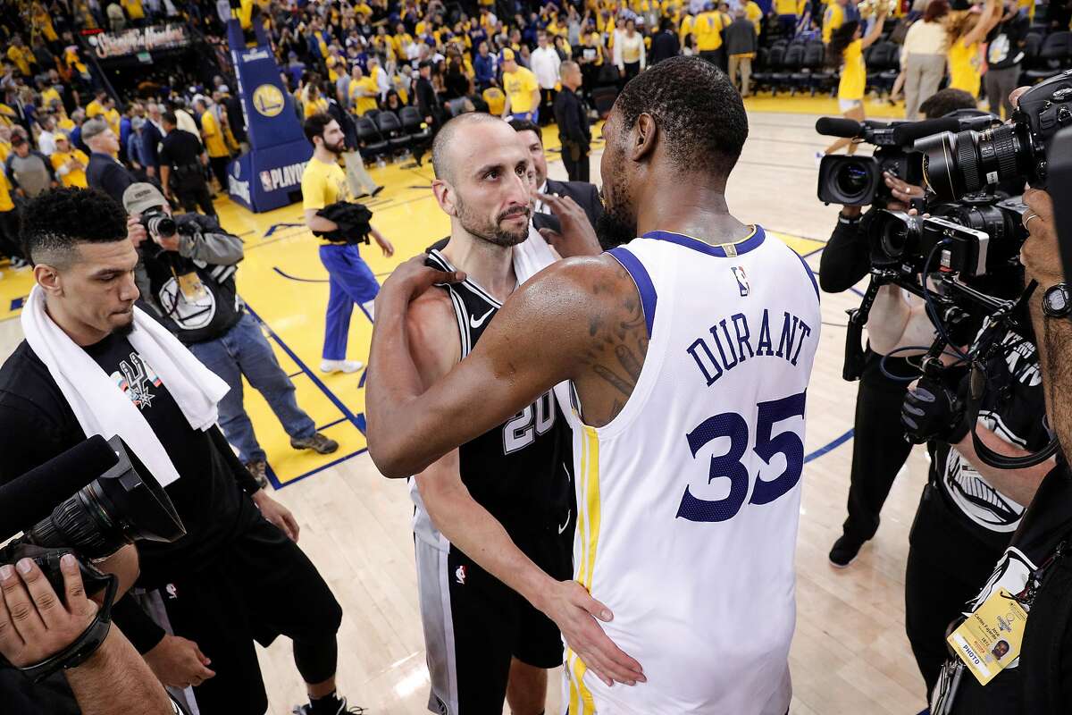 Golden State Warriors' Kevin Durant and San Antonio Spurs' Manu Ginobili speak after the Warriors defeated the Spurs 99 to 91 in game 5 of round 1 of the Western Conference Finals at Oracle Arena on Wednesday, April 25, 2018 in Oakland, Calif.