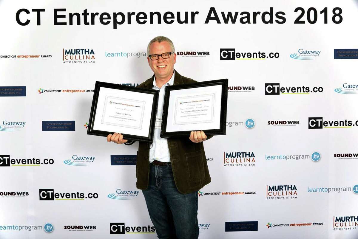 New Milford's Tony Vengrove of Makery Co-Working celebrates after earning recognition at the 2018 CT Entrepreneur Awards held in April 2018 at Gateway Community College in New Haven, Conn.