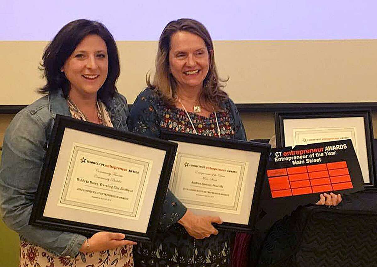 Bethel's Bobbi Jo Beers and Danbury's Andrea Gartner celebrate after earning recognition at the 2018 CT Entrepreneur Awards held in April 2018 at Gateway Community College in New Haven, Conn.
