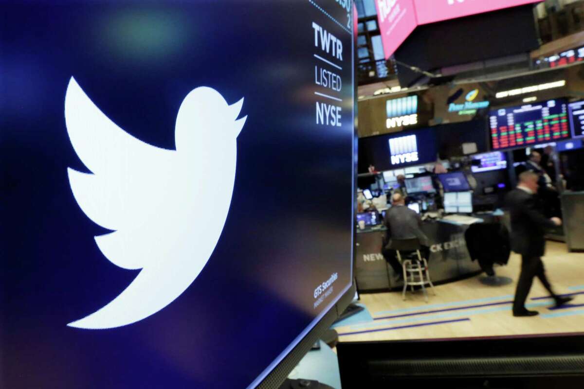 FILE- In this Feb. 8, 2018, file photo the logo for Twitter is displayed above a trading post on the floor of the New York Stock Exchange. The company on Wednesday posted only its second profitable quarter and despite some strong growth overseas, many on Wall Street remain jittery about its prospects.