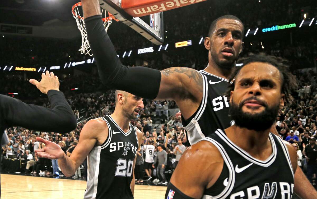 SAN ANTONIO,TX - APRIL 22 : Manu Ginobili #20, LaMarcus Aldridge and Patty Mills #8 of the San Antonio Spurs celebrate after winning Game Four of Round One of the 2018 NBA Playoffs against the Golden State Warriors at AT&T Center on April 22 , 2018 in San Antonio, Texas. NOTE TO USER: User expressly acknowledges and agrees that , by downloading and or using this photograph, User is consenting to the terms and conditions of the Getty Images License Agreement. (Photo by Ronald Cortes/Getty Images)