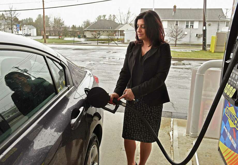 Gina Boilard of Rotterdam fills the gas tank in her car at a Sunoco gas station on Wednesday April 25, 2018 in Rotterdam, N.Y. (Lori Van Buren/Times Union) Photo: Lori Van Buren / 40043606A 