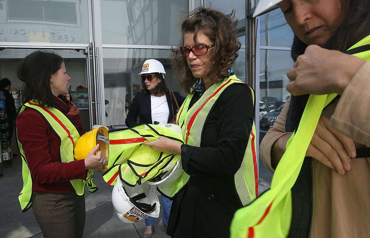 SFMade CEO Katie Sofis (middle right) prepares to give a tour of the new PDR/industrial building at 100 Hooper St., near Mission Bay on Wednesday, April 25, 2018, in San Francisco, Calif.