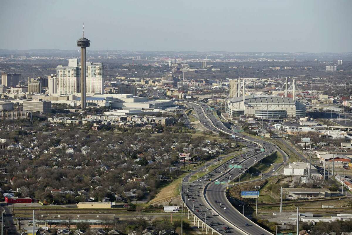 Traffic moves along IH-37 between the Tower of the Americas and the Alamodome, Thursday, Feb. 18, 2016. San Antonio grew in raw numeric population numbers between July 1, 2016 and July 1, 2017.