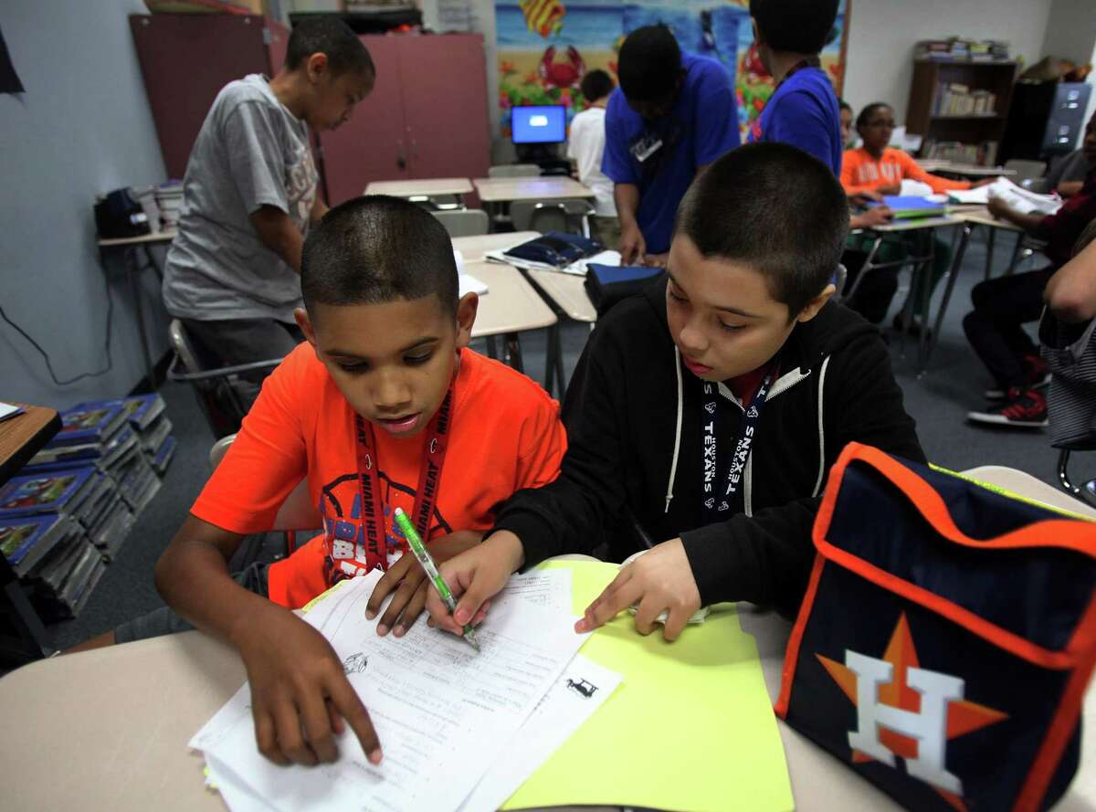 Jordan Taylor and Cesar Cerrantes finish their social studies group activity at Macario Garcia Middle School on April 18, 2013, in Sugar Land. Improving educational opportunities will be a priority for the Texas Senate Hispanic Caucus, says the new chairman.