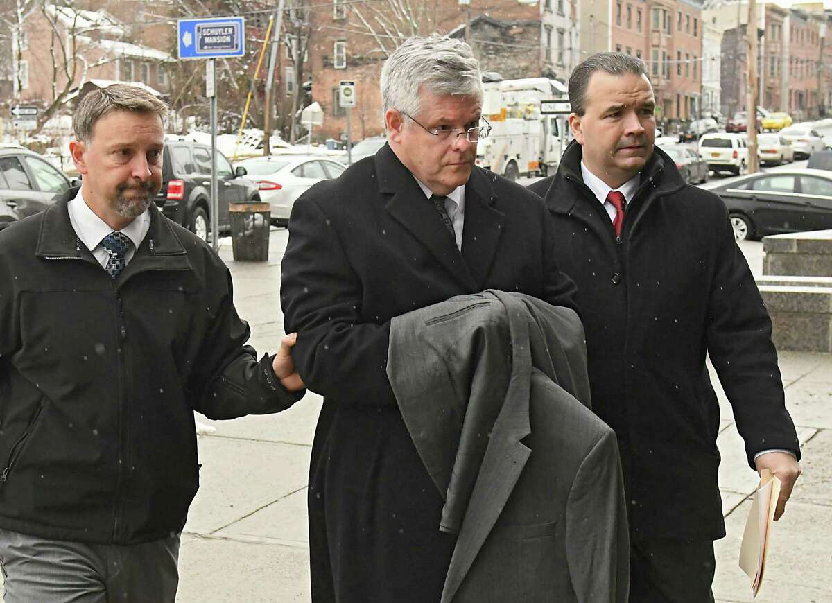 Richard J. Sherwood, town justice in Guilderland, is brought into City Court by police officers after being arrested on Friday, Feb. 23, 2018, in Albany, N.Y. (Lori Van Buren/Times Union archive)
