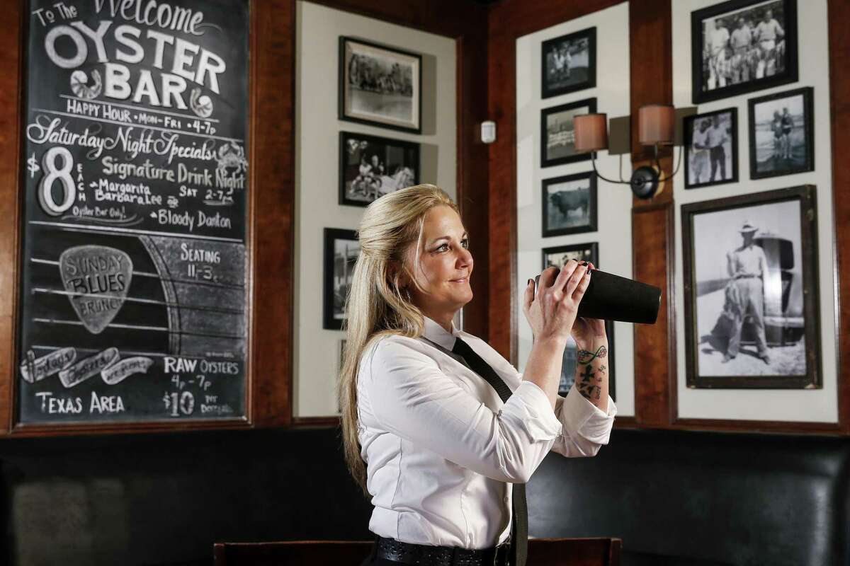 Danton's Gulf Coast Seafood and Steaks bartender Lisa Alexander shakes up one of her cocktail creations, the Puerto Rico, Tuesday, April 3, 2018 in Houston. (Michael Ciaglo / Houston Chronicle)