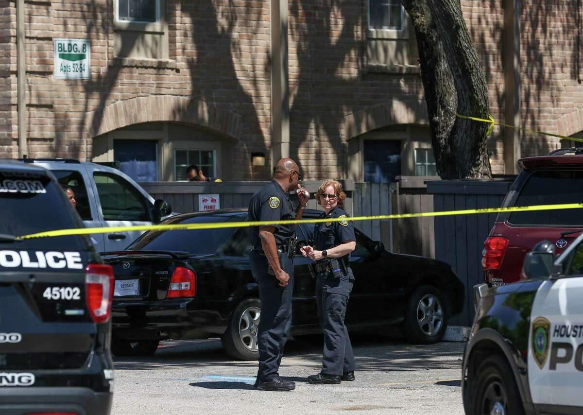 Houston Police officers investigate the scene of a shooting, where a woman died on the 11800 block of Chimney Rock Road Wednesday, April 25, 2018, in Houston.