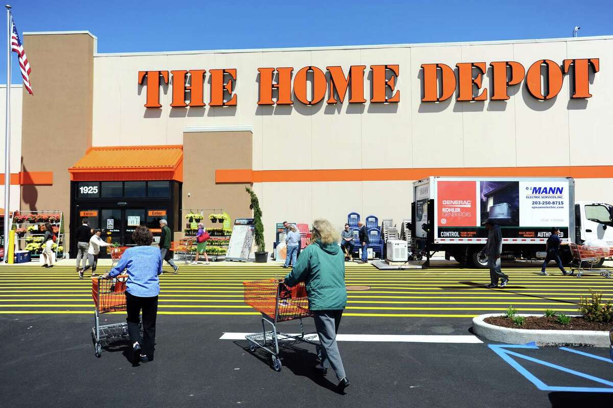 Shoppers walk into the new Home Depot store at 1925 W. Main St., on the west side of Stamford, Conn., on its opening day on Thursday, April 26, 2018.