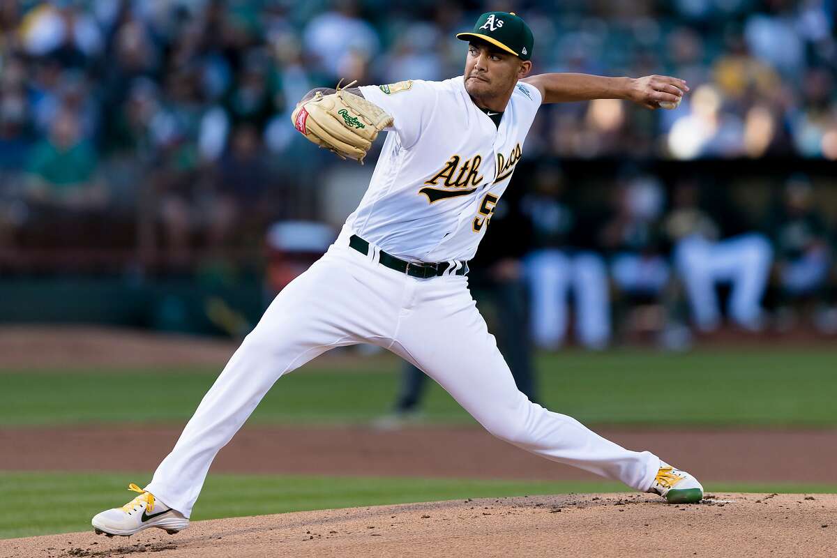FILE - In this April 21, 2018, file photo, Oakland Athletics starting pitcher Sean Manaea throws against a Boston Red Sox batter in the first inning of a baseball game in Oakland. The 6-foot-five lefty threw a no-hitter against the Red Sox. (AP Photo/John Hefti, File)