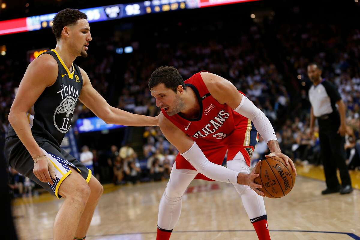 New Orleans Pelicans forward Nikola Mirotic (3) against Golden State Warriors guard Klay Thompson (11) during the second half of an NBA game between the Golden State Warriors and New Orleans Pelicans at Oracle Arena on Saturday, April 7, 2018, in Oakland, Calif. The Warriors lost 126-120.