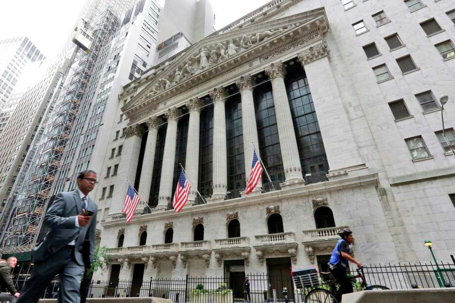 FILE- In this Oct. 24, 2017, file photo, people pass the New York Stock Exchange. The U.S. stock market opens at 9:30 a.m. EDT on Thursday, April 26, 2018. (AP Photo/Richard Drew, File) Photo: Richard Drew / AP