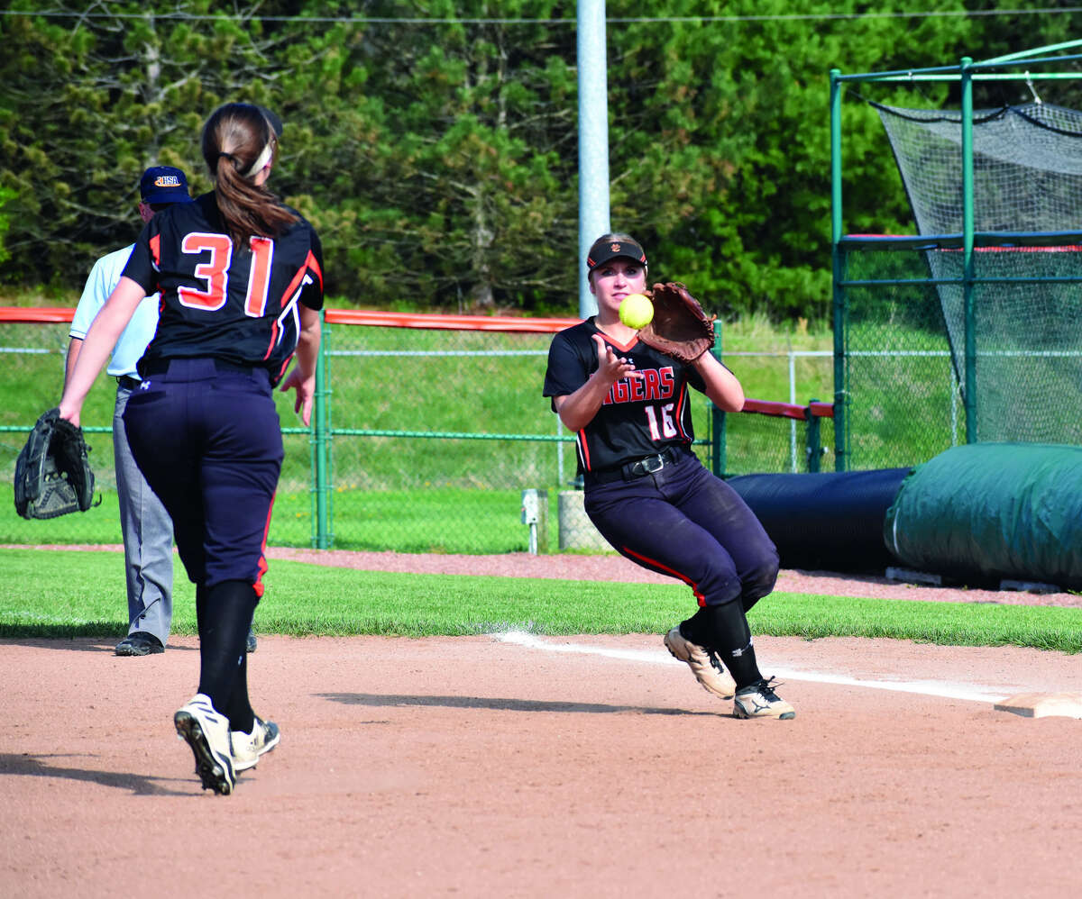 EHS first baseman Mackenzie Owens, left, flips a throw to second baseman Emma Lewis to record an out at first against Granite City on Thursday.