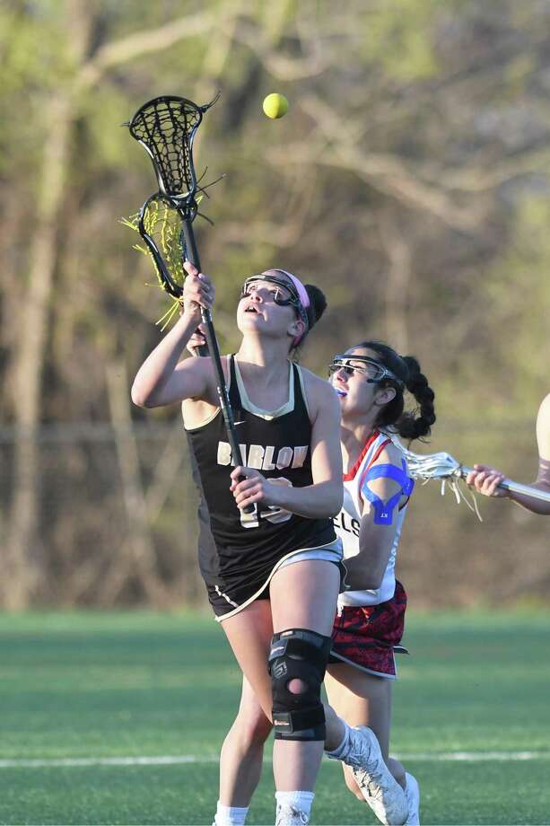 Barlows Bella Miceli, left, and New Fairfields Katelyn Sousa eye the ball during the New Fairfield versus Joel Barlow SWC girls lacrosse game in New Fairfield, April 26, 2018. Photo: Krista Benson / The News-Times Freelance