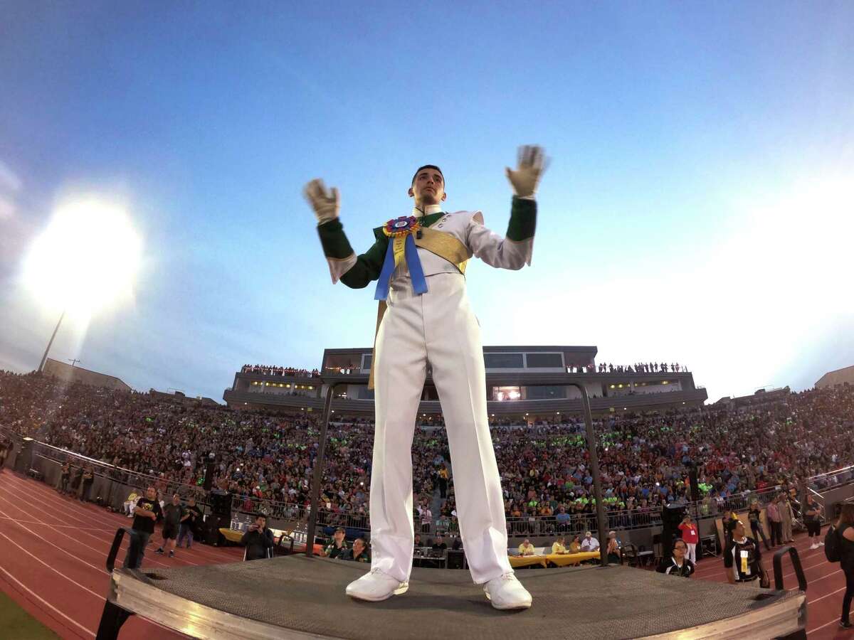 Eric Martinez, drum major of the McCollum band, directs during the Battle of Flowers Association's annual band festival at Alamo Stadium on Thursday, April 26, 2018. The 80th annual festival featured performances by more than 30 high school bands.