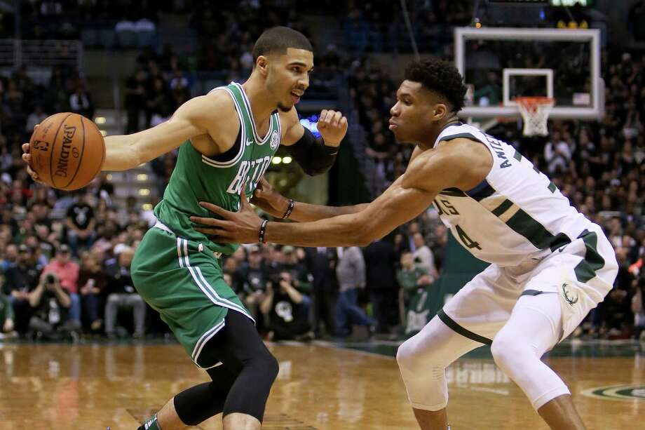MILWAUKEE, WI - APRIL 26:  Jayson Tatum #0 of the Boston Celtics dribbles the ball while being guarded by Giannis Antetokounmpo #34 of the Milwaukee Bucks in the second quarter during Game Six of Round One of the 2018 NBA Playoffs at the Bradley Center on April 26, 2018 in Milwaukee, Wisconsin. NOTE TO USER: User expressly acknowledges and agrees that, by downloading and or using this photograph, User is consenting to the terms and conditions of the Getty Images License Agreement. (Photo by Dylan Buell/Getty Images) Photo: Dylan Buell / 2018 Getty Images