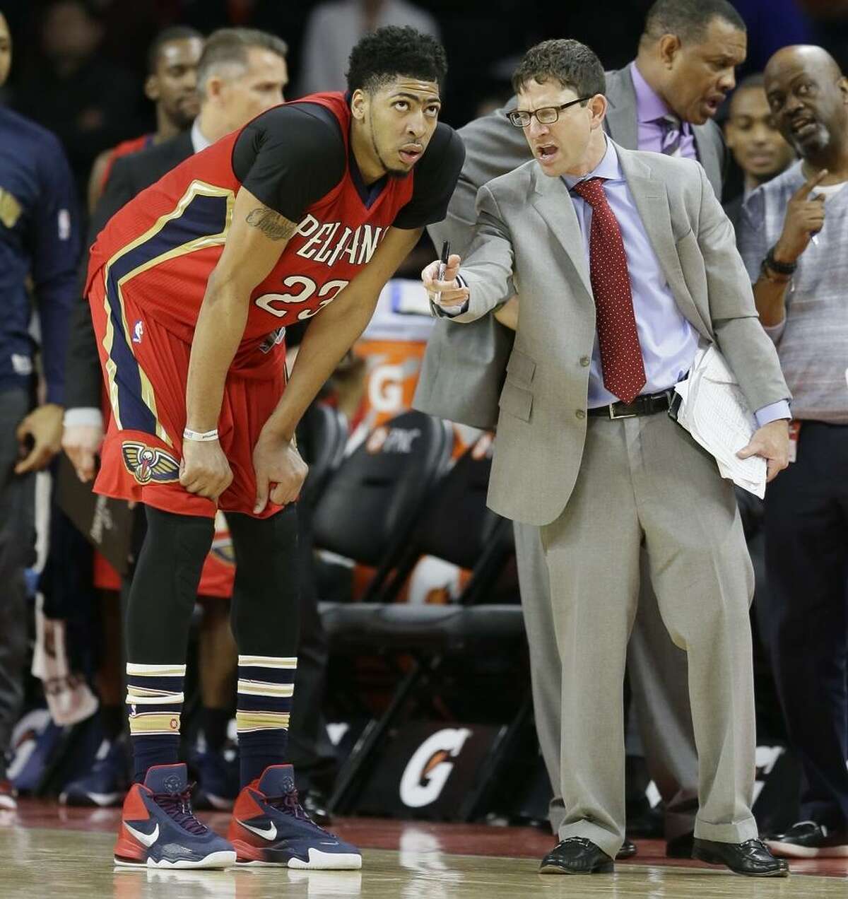 Pelicans forward Anthony Davis talks with assistant coach Darren Erman, whose defensive schemes are key to success.