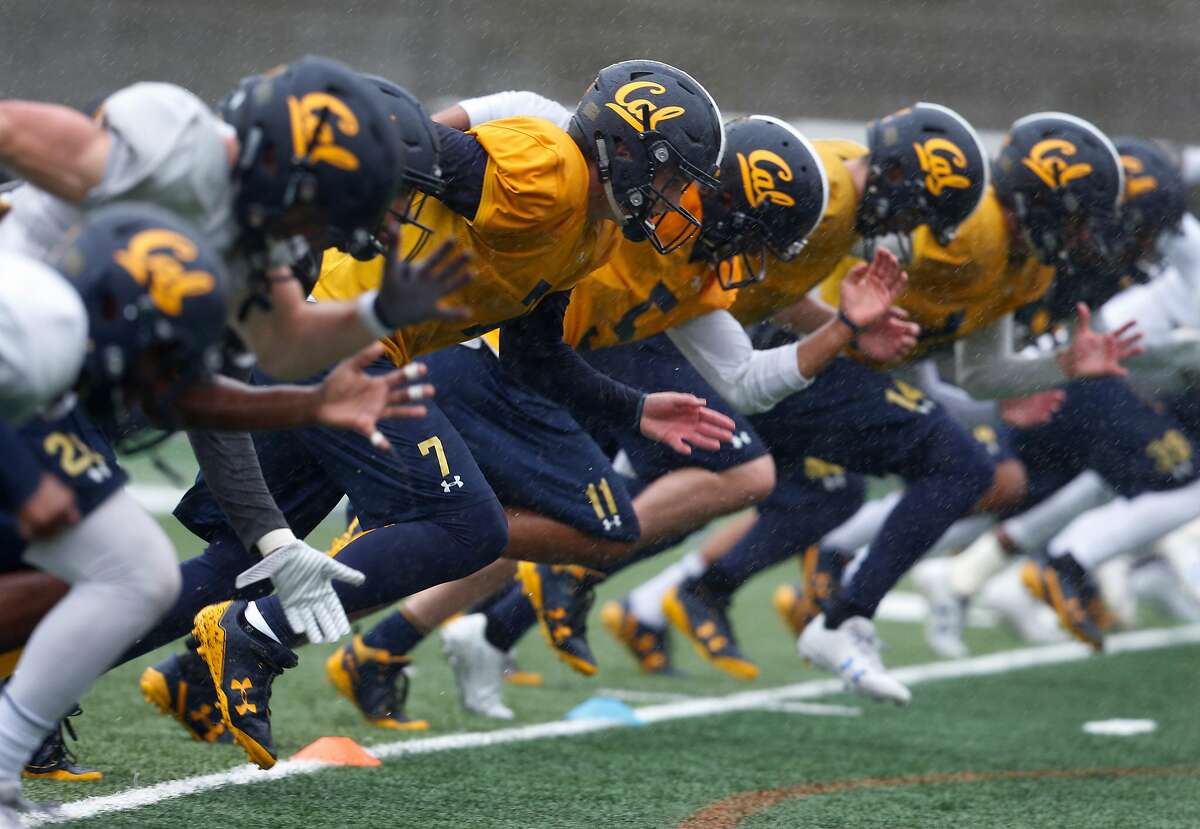 Quarterback Chase Garbers (7) runs wind sprints with teammates during a Cal Bears football practice in Memorial Stadium at UC Berkeley on Friday, April 6, 2018.