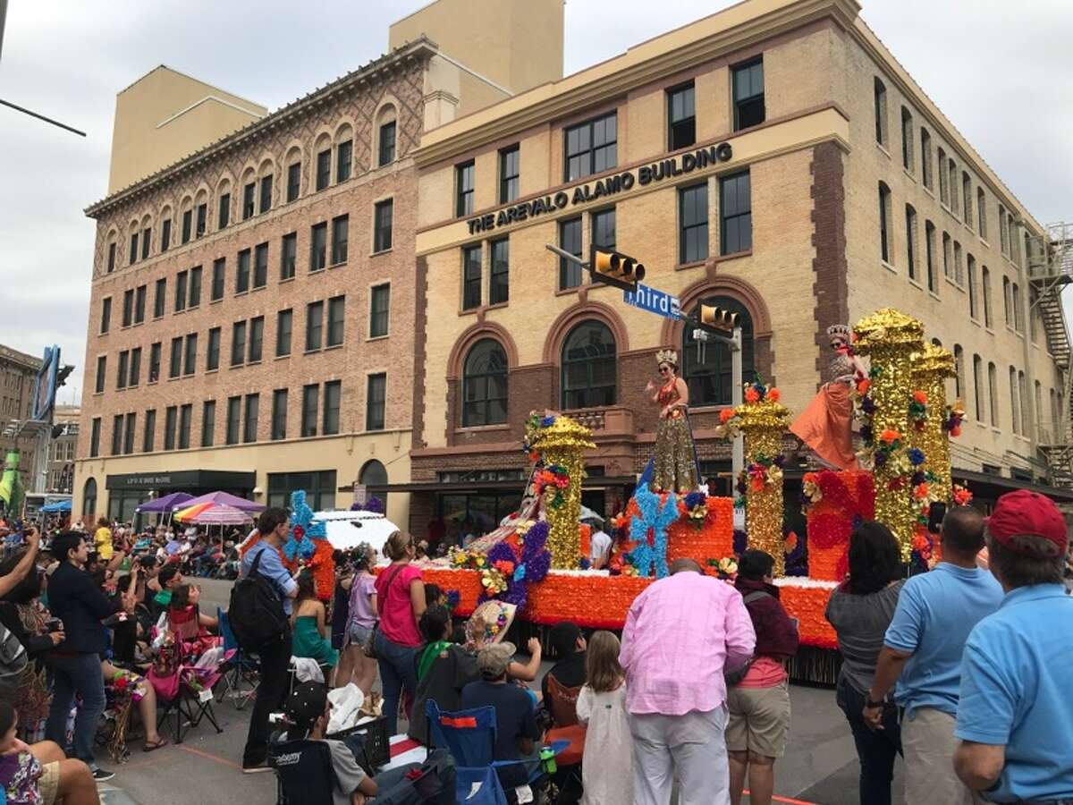 After: Downtown streets are typically quiet during a regular work day, but are brought to life for the Battle of Flowers parade as thousands of locals take over the streets in the annual San Antonio tradition.
