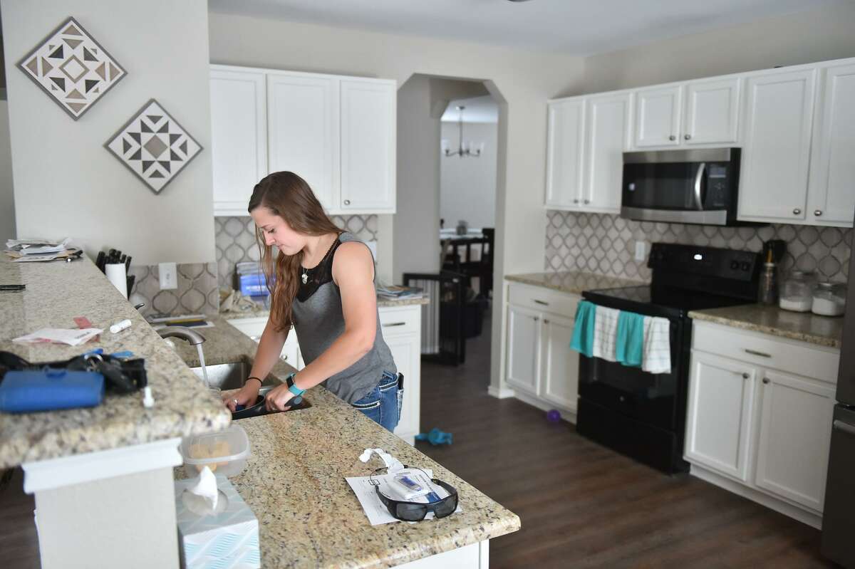 Bailey Hallberg in her new home. A new homeowner, Hallberg managed to lock down her home after making offers on two others but missing out because their owners were flooded with offers.