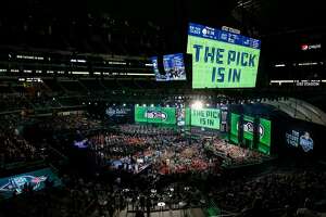 ARLINGTON, TX - APRIL 26:  A video board displays the text "THE PICK IS IN" for the Seattle Seahawks during the first round of the 2018 NFL Draft at AT&amp;T Stadium on April 26, 2018 in Arlington, Texas.  (Photo by Tim Warner/Getty Images)