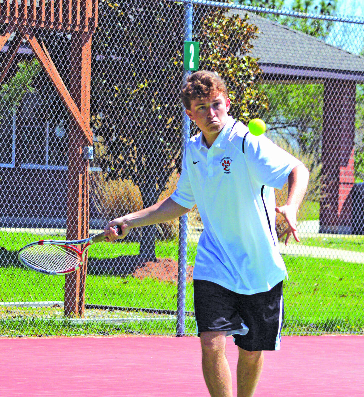 Edwardsville junior Nick Hobin makes a forehand return during his No. 1 singles match on Saturday in the Tiger Duals at the EHS Tennis Center