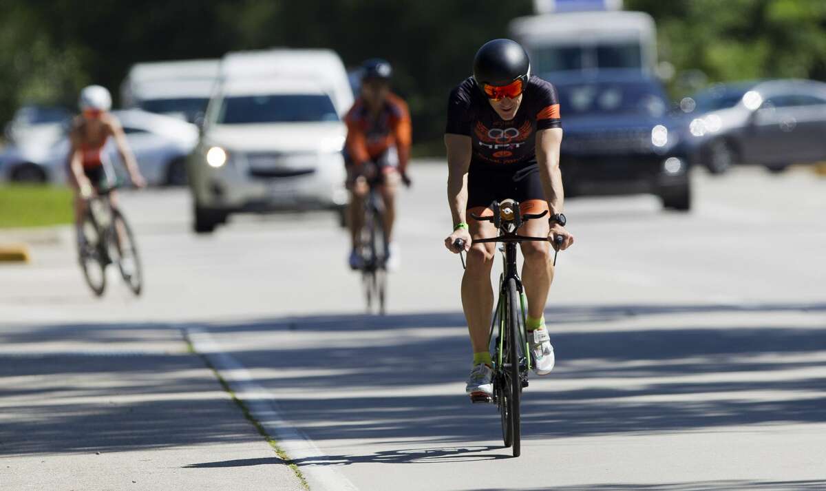 Ironman course comes up two miles short; 2 new world records hold