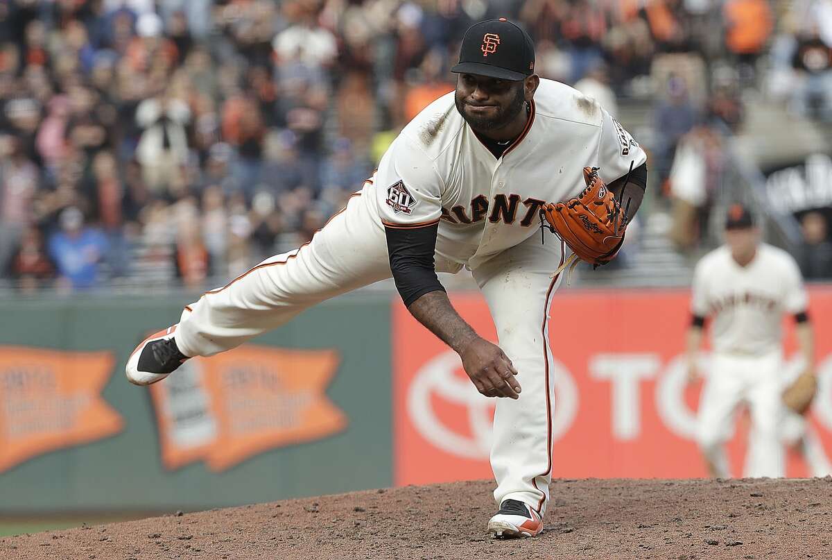 San Francisco Giants' Pablo Sandoval pitches against the Los Angeles Dodgers during the ninth inning.