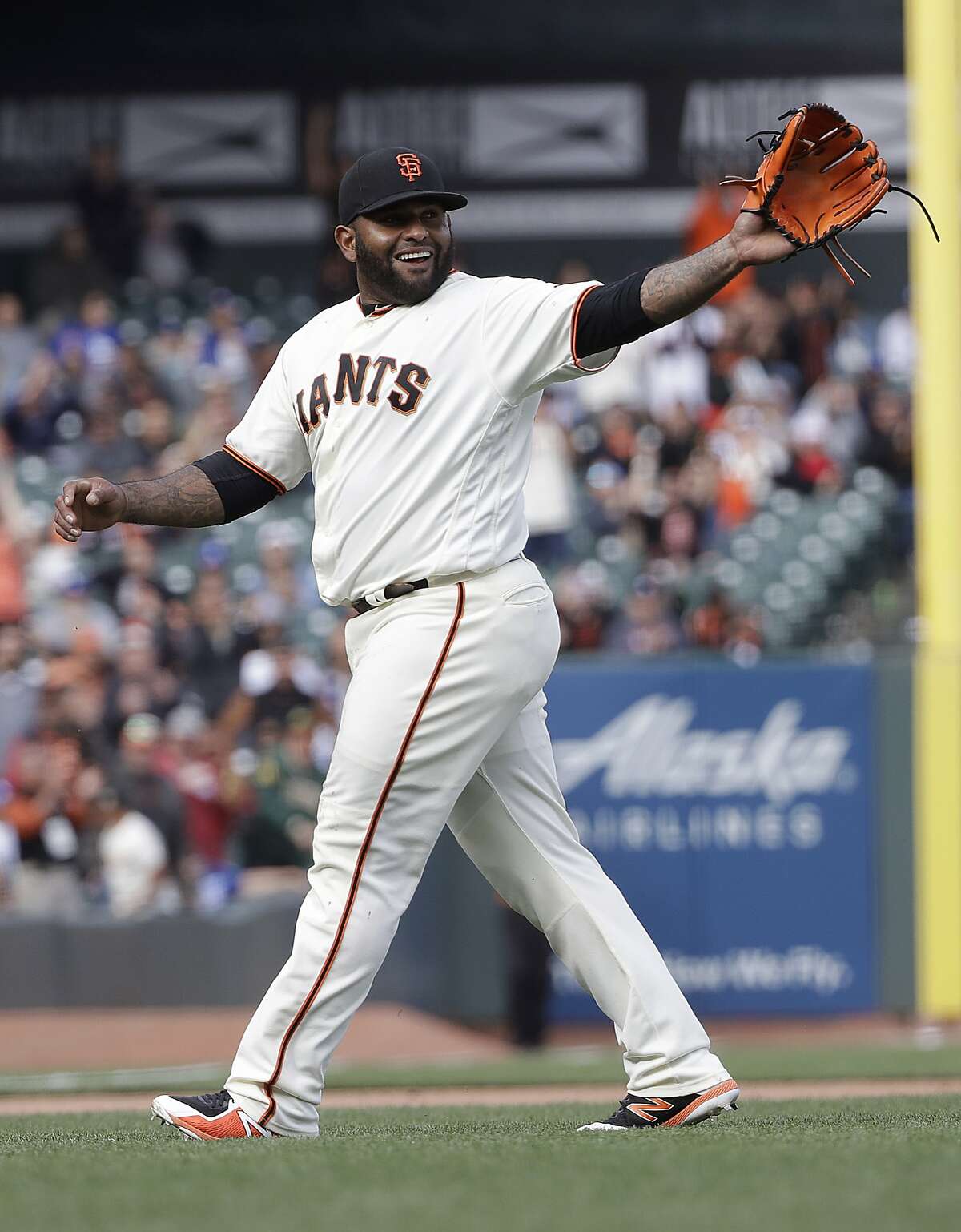 San Francisco Giants' Pablo Sandoval smiles after pitching against the Los Angeles Dodgers during the ninth inning of a baseball game in San Francisco, Saturday, April 28, 2018. 