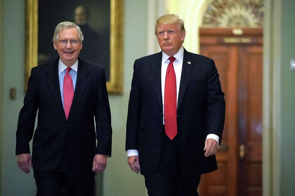 WASHINGTON, DC - OCTOBER 24: Senate Majority Leader Mitch McConnell (R-KY) (L) and U.S. President Donald Trump arrive for the Republican Senate Policy Luncheon at the U.S. Capitol October 24, 2017 in Washington, DC. Trump joined the senators to talk about upcoming legislation, including the proposed GOP tax cuts and reform. (Photo by Chip Somodevilla/Getty Images) ORG XMIT: 775063760