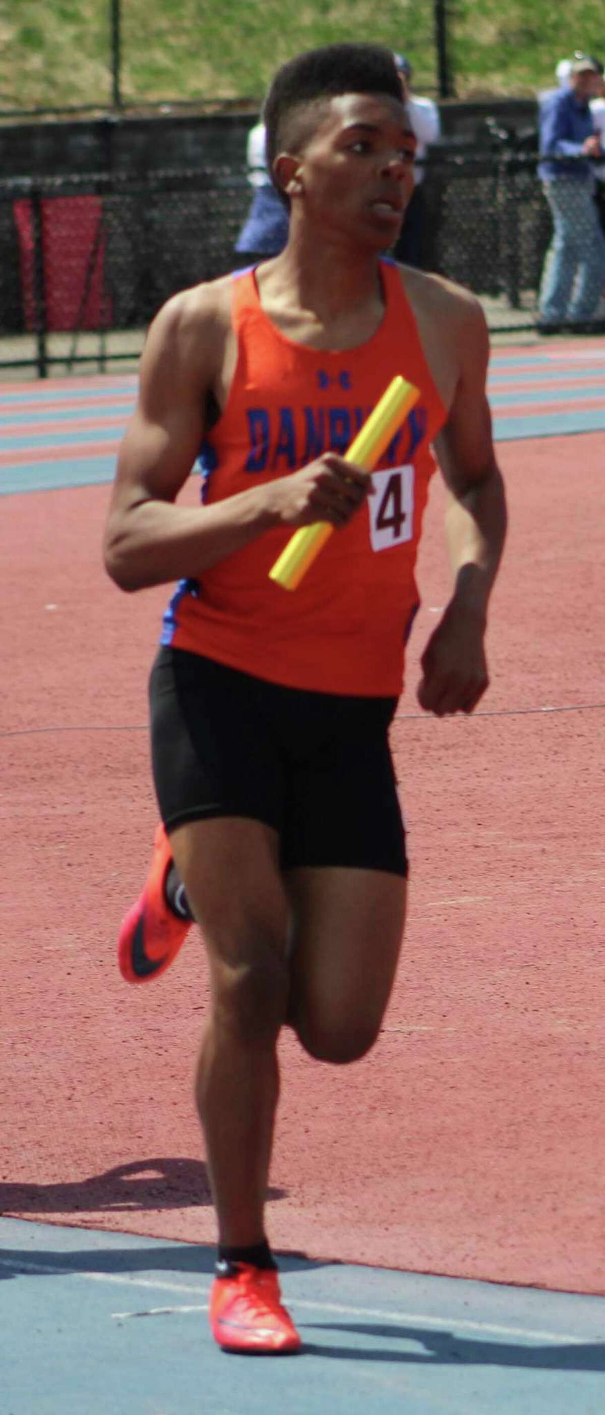 Danbury's Glenroy Ford competes in the boys 4x800 relay at the O'Grady Relays at Danbury High School April 28, 2018.