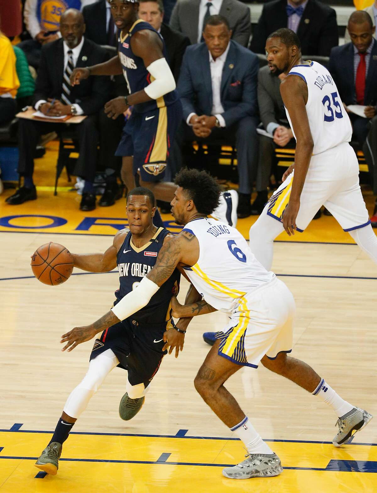 New Orleans Pelicans' Rajon Rando tries to get past Golden State Warriors' Nick Young in the first quarter during game 1 of round 2 of the Western Conference Finals at Oracle Arena on Saturday, April 28, 2018 in Oakland, Calif.
