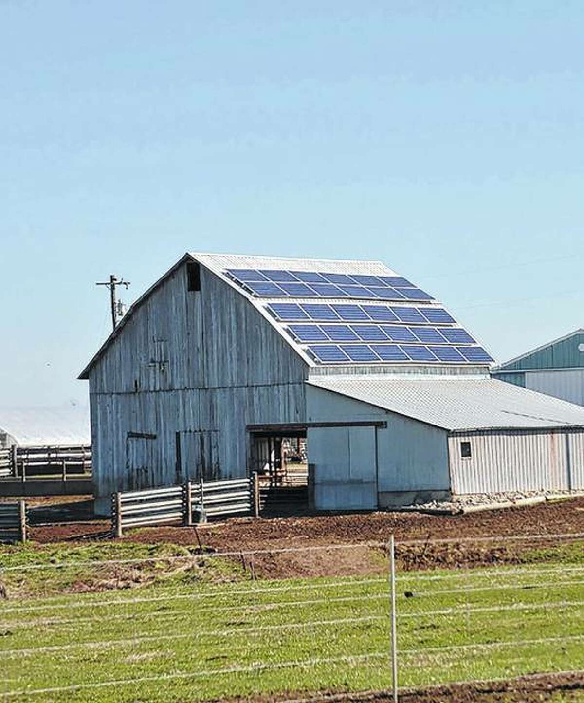 A solar array can be seen on a barn at Rhodes Farm on Illinois Route 108 in Macoupin County. It faces south, collecting sunlight and converting it into usable energy for the farm.