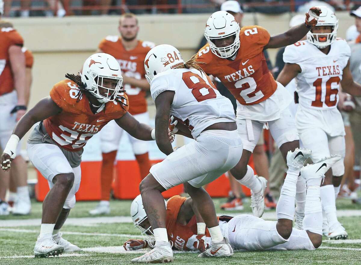 Linebacker Demarco Boyd (36) moves in on Lil'Jordan Humphrey with Kris Boyd (2) following at the UT Orange-White Spring Game at DKR Stadium on April 21, 2018.