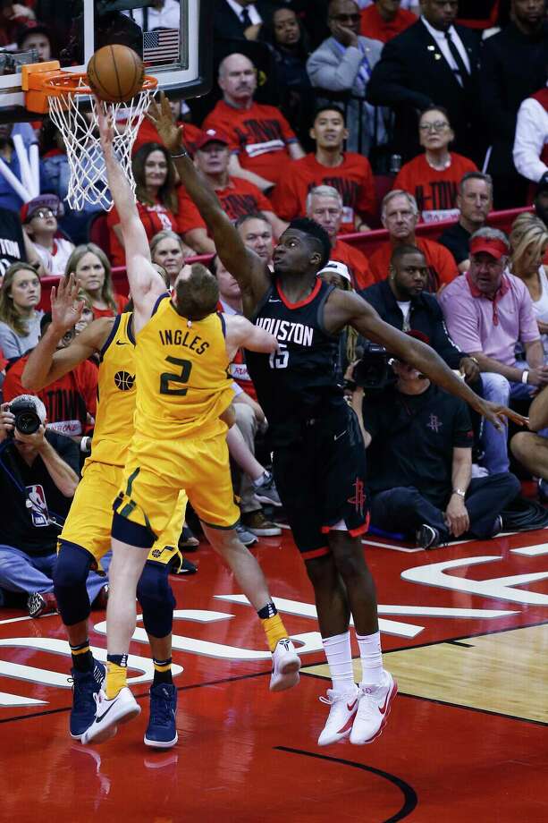 clint capela (15) defends a shot by utah jazz forward joe ingles